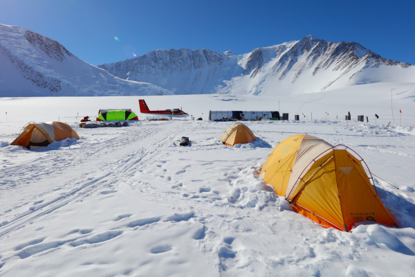 Guest sleeping tents at Vinson Base Camp with main ALE tent Twin Otter and Mount Vinson in the background Alexey Nagaev ALE